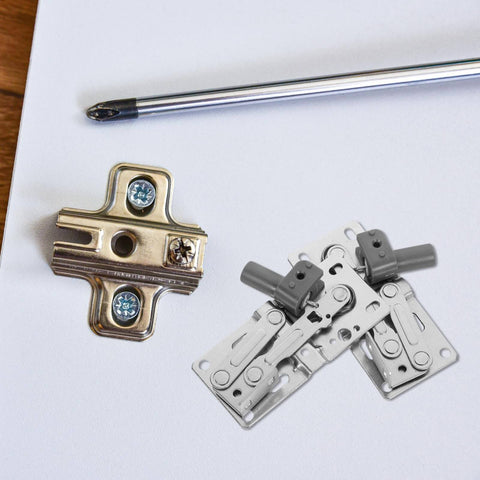 2 Pack Soft Close Cabinet Hinges With 45 Degree Tip-Out Tray with screwdriver on wooden surface