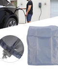Heavy Duty Kickass Weatherproof Electric Vehicle Charger Cover Shields Wall Mounted Charging Station showing gray polyester cover and charging EV.