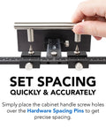 Hand using Cabinet Hardware Jig With Patent Pending True Calibration And Laser Engraved Rulers for accurate handle spacing