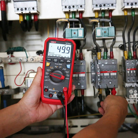 Digital Multimeter Kit for DIYers and pros with True RMS readings up to 1000V AC DC, displaying 49.9 in a control panel test