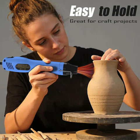 Person using Dual Temp Heat Gun With Two Speed Settings 250C And 350C 482F And 662F Fast Heat for crafting pottery.