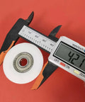 Top Gear Bearing Pulley Wheel Replacement Roller For Rowing Machine Cables, 42mm white steel, measuring with caliper.