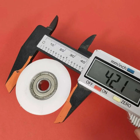 Top Gear Bearing Pulley Wheel Replacement Roller For Rowing Machine Cables, 42mm white steel, measuring with caliper.
