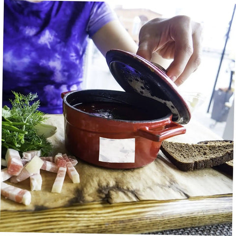 Person opening a red ceramic pot on a wooden board with herbs and bread, Heavy Duty High Temperature Leak Stop Tape For Home Plumbers Multi Purpose Seal Strip Ideal For Radiators Pots Buckets Aluminum Repair Oilproof And Tear Resistant Waterproof Water Leak Sealing Tape.