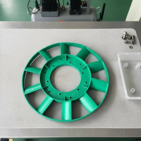 Heavy Duty Compressor Cooling Fan Replacement Impeller With Precision Molded Rotor And Balanced Hub on workbench, showcasing green plastic material.