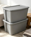 Heavy Duty 30 Gallon Plastic Storage Bin With A No Hassle Snap Closure Built Tough For Massive Household Items Plus Plenty Of Room For Seasonal Gear stacked in a living room.