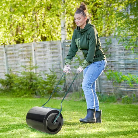 Woman using Lawn Roller For Sod Flattening And Soil Compaction With 16 Gallon Fill Capacity Heavy Duty Adjustable Weight System