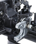 Close-up of One Tenth Scale 4x4 On Road RC Rolling Chassis Frame Kit with adjustable wheelbase and visible gear components.