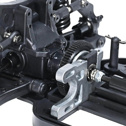 Close-up of One Tenth Scale 4x4 On Road RC Rolling Chassis Frame Kit with adjustable wheelbase and visible gear components.