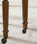Antique Brass Caster Wheels Set Of Four With Rubber Wheels And Five Sixteenth Inch By One And One Half Inch Stem Sockets installed on furniture