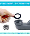 Hand holding a rubber seal for One Point Five Inch Low Profile Tub Drain Kit With Flexible P Trap And Easy Turn End Nuts.