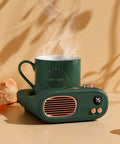 Keep Your Favorite Brew Piping Hot Desk Mug Warmer With Three Cozy Heat Levels And Gentle Glow Indicator For Home Office Coffee Cup Beverage Heater Continuously Locking In Ideal Sipping Temperatures Evergreen with steaming green mug.