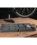 SAE And Metric 100 Piece Socket Set With One Quarter Inch Drive Three Eighths Inch Drive And One Half Inch Drive Plus Bit Set on workbench