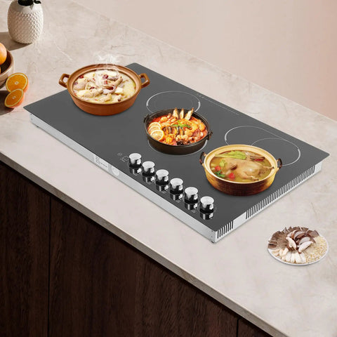 Quick Cookin' Electric Ceramic Cooktop With Five Adjustable Burners Infrared Stove Top with dishes on display and knobs visible.
