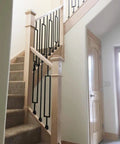 Staircase with slanted baluster shoes, satin black aluminum set of 30 for 1/2 in square balusters on knee wall, not for 30-degree stairs.