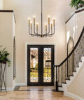 8 Light Farmhouse Chandelier With Dope Black And Gold Finish Modern Candle Pendant Lighting in foyer over staircase.