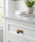 Killer Style Beaded Zinc Alloy Cabinet Knobs With Backplate Antique Brass 6 Pack on white cabinet with marble top.