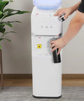 Person using Hot Cold Water Dispenser With Warm Setting, Three Temperature Modes, 5 Gallon Floor Standing Electric Cooler