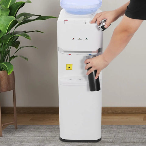Person using Hot Cold Water Dispenser With Warm Setting, Three Temperature Modes, 5 Gallon Floor Standing Electric Cooler