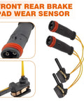 Brake pad wear sensor kit with black sensor housings, red seals and yellow wiring; shown with brake pad.