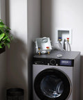 Laundry setup showing Crimp PEX Washing Machine Outlet Box With Center Drain, 1/2 Inch PEX Inlet To 3/4 Inch MHT Outlet on washer.