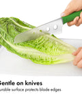 Hands cutting lettuce on Two Piece Cutting Board Set For Kitchen Prep With One Small Prep Board And One Large Everyday Board Non Porous
