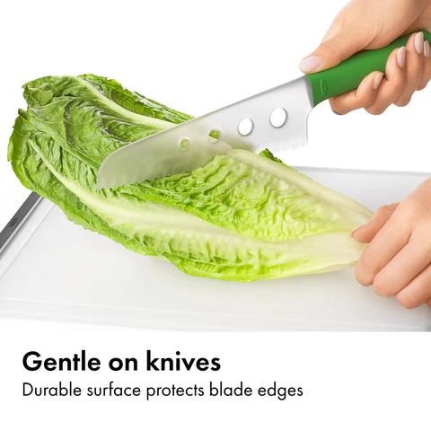 Hands cutting lettuce on Two Piece Cutting Board Set For Kitchen Prep With One Small Prep Board And One Large Everyday Board Non Porous