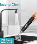 Ultra Fast Digital Meat Thermometer With Backlight And Foldable Probe being cleaned under a kitchen tap, showing waterproof feature
