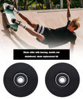 Skateboarder performing trick with 4 Pack 54mm Quad Roller Skate Wheels 80A Hardness With ABEC Nine Bearings Black Durable PU Replacement.