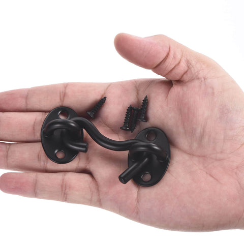 Two Pack 2 Inch Hook And Eye Latch For Privacy Stainless Steel Barn Door Lock Hardware in black finish, shown on hand