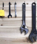 Rock Solid Black L Shape Screw Hooks Heavy Duty Wall Mount Hangers Super Durable Rust Proof Steel Cup Hooks For Shed Garden Patio Closet Storage Solutions 20 Pieces holding various tools on wooden surface.