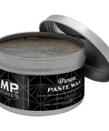 Top Shelf Wood Finish Paste Wax For Furniture Cabinets And Tabletops Blends Carnauba And Beeswax To Lock In A Smooth As Silk High Shine Barrier That Leaves Zero Sticky Residue While Adding Badass Protection In An Easy Eight Ounce Jar in an open tin.