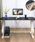 Modern White Gaming Desk Featuring A Built In Phone Slot And Side Storage Shelf, Ergonomic Arc Edge Layout For Smooth Typing with a sleek black top.