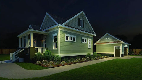 HomeGuard 2 Light LED Outdoor Flood Lights With Motion Sensor And Dusk To Dawn illuminating house and driveway at night