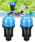 Two blue plastic air release valves with black bases, 3/4 in NPT, installed on irrigation pipe.