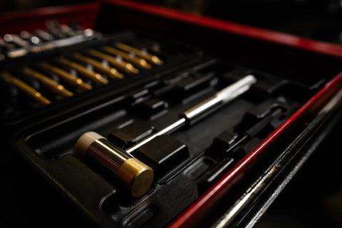 Top Shelf Hammer And Punch Set With Durable Brass Strikers, Polished Steel Heads For Zero Fuss Gunsmithing And Firearm Maintenance, Includes Heavy Duty Storage Box For Your Home Shop Setup, showing hammer and punches in kit.