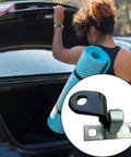 Automotive rear upper left door hinge; black metal with mounting tab, close-up view