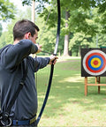Archer aiming at a 20 Inch Square Archery Target With Rope Handle Lightweight High Density EVA Foam Practice Target in a backyard