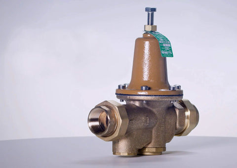 Side view of Watts LF25AUB-Z3 water pressure reducing valve, brass body, 3/4 inch NPT female unions.