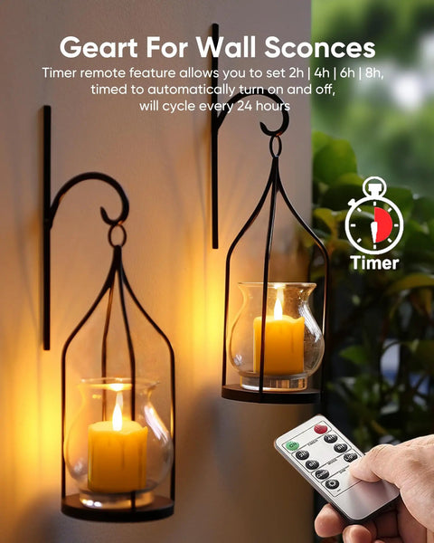 Person using remote with Six Pack Remote Timer Flameless Candles 2x2 LED Votive Lights Battery Operated in wall sconces.