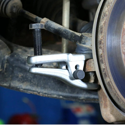 Beefy Adjustable Ball Joint Separator Tool For Auto Repairs Durable Steel Construction With Black Oxide Pins in use on vehicle