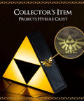 Legend Of Zelda Triforce Night Light LED Decorative Lamp projecting Hyrule Crest, gold emblem on black, for game room or desk.