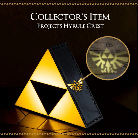 Legend Of Zelda Triforce Night Light LED Decorative Lamp projecting Hyrule Crest, gold emblem on black, for game room or desk.