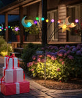 Four Pack Solar Pathway Lights For Garden And Yard With Waterproof Metal Stakes Outdoor Patio Walkway Lighting Warm White Lanterns Auto Dusk To Dawn Up To Eight Hours Of Night Light with colorful decorations in garden setting