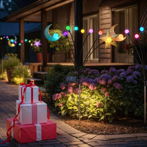 Four Pack Solar Pathway Lights For Garden And Yard With Waterproof Metal Stakes Outdoor Patio Walkway Lighting Warm White Lanterns Auto Dusk To Dawn Up To Eight Hours Of Night Light with colorful decorations in garden setting