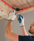 Person installing 20 Pack One Half Inch PEX Tubing Bend Support 90 Degree Elbow Clamp With Nail Tab under wooden ceiling.
