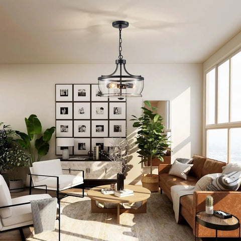 Firedanz 3-Light Glass Pendant Light, Height Adjustable, above a stylish living room with white chairs and plants.