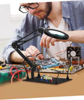Five Piece Third Hand Soldering Tool Set with Flexible Gooseneck Arm and Rotating Alligator Clips in use for electronics repair