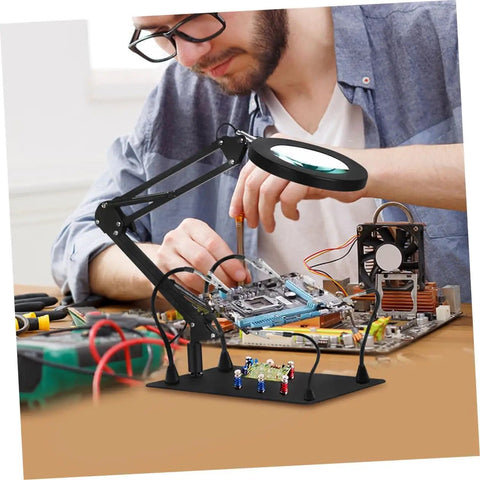 Five Piece Third Hand Soldering Tool Set with Flexible Gooseneck Arm and Rotating Alligator Clips in use for electronics repair