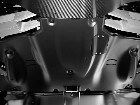 Crush Proof Hydroformed Aluminum Skid Plates For Tesla Model Y Front And Rear With Thick Acoustic Foam To Zero Out Road Noise And Shield Critical Axles During Rough Drives 2020 To 2025, underside view showing smooth surface and fasteners.